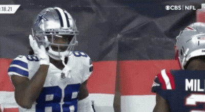 Football Player In Helmet 28 Next To Player In Jersey GIF