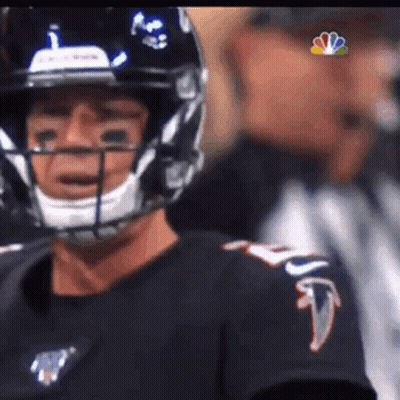 Football Player In Helmet And Black Shirt Before Referee GIF