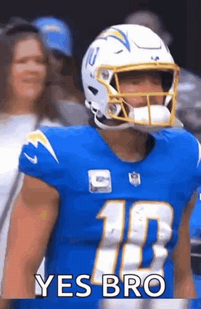 Football Player In Helmet And Blue Jersey In Front Of Crowd GIF