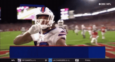 Football Player In Helmet And Gloves Standing On Field GIF