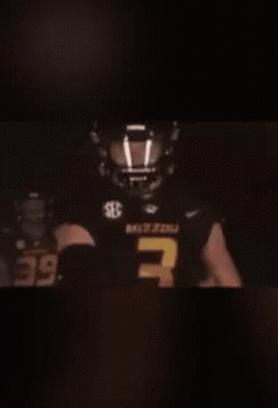 Football Player In Helmet And SEC Shirt GIF