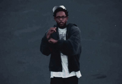 Football Player In Helmet And White Jersey Standing On Field GIF