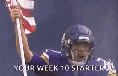 Football Player In Helmet Holding American Flag GIF