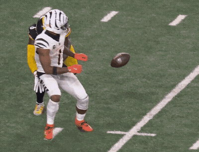 Football Player In Helmet In Front Of Crowd GIF