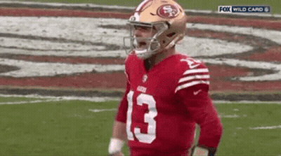 Football Player In Helmet On Field GIF