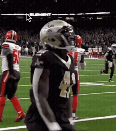 Football Player In Helmet Standing On Field GIF