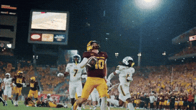Football Player In Maroon Jersey #10 Throwing Ball GIF