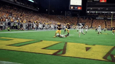 Football Player In Maroon Jersey Number 10 Throwing Ball GIF