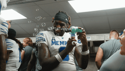 Football Player In Memphis Jersey Blowing Bubbles GIF