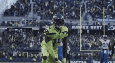 Football Player In Neon Green Uniform Running GIF