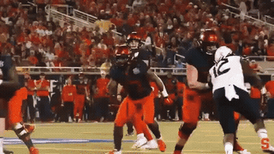 Football Player In Number 10 Jersey Tackled GIF