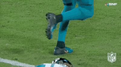 Football Player In Number 16 Jersey Lying On Field GIF