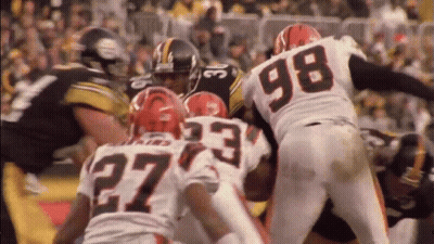 Football Player In Number 27 Jersey Surrounded By Players GIF