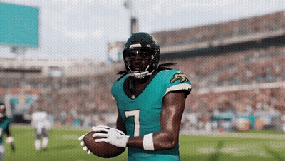 Football Player In Number 7 Jersey Holding Football GIF