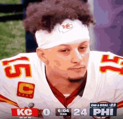 Football Player In Number 75 Jersey Next To Another Player GIF