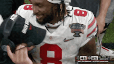 Football Player In Number 9 Jersey Being Interviewed GIF