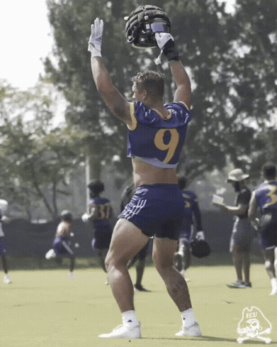 Football Player In Number 9 Jersey Holding Helmet GIF