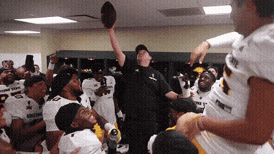 Football Player In Oklahoma State Jersey Making Heart Hands GIF