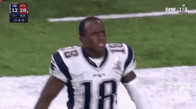 Football Player In Patriots Jersey Standing On Field GIF