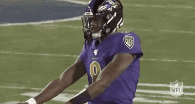 Football Player In Purple Jersey And Black Helmet GIF
