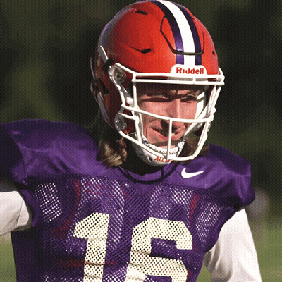 Football Player In Purple Jersey And Red Riddell Helmet GIF