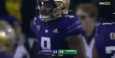 Football Player In Purple Jersey Helmet GIF