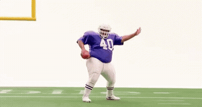 Football Player In Purple Jersey Jumping GIF