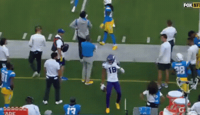 Football Player In Purple Uniform Dancing On Field GIF