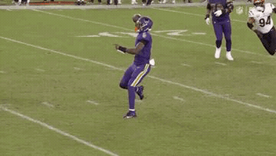 Football Player In Purple Uniform Jumping GIF