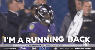 Football Player In Purple Uniform Running Back GIF