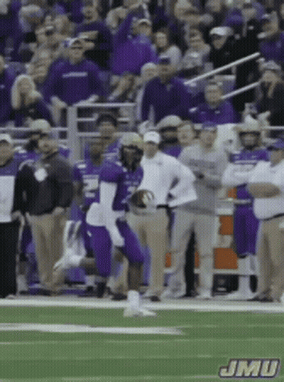 Football Player In Purple Uniform Running With Ball GIF