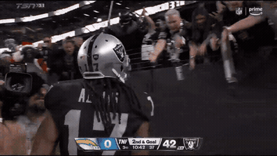 Football Player In Raiders Helmet In Front Of Crowd GIF