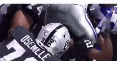 Football Player In Raiders Jersey Being Tackled GIF