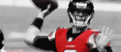 Football Player In Red And Black Uniform Throwing Football GIF