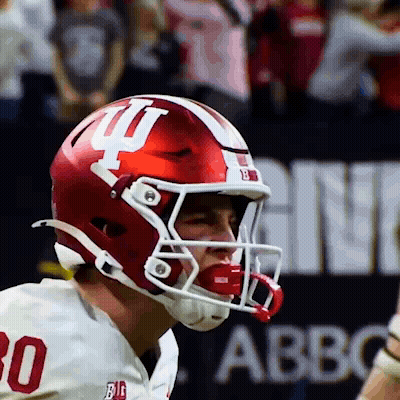 Football Player In Red And White Helmet With Letter I GIF