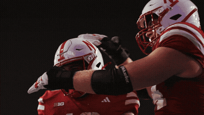 Football Player In Red And White Uniform With Big GIF
