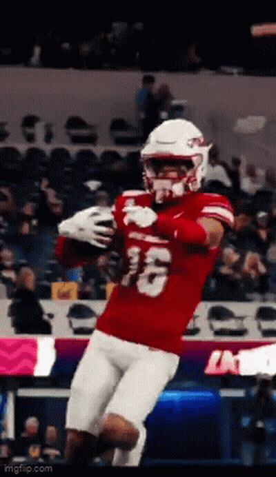 Football Player In Red Jersey Catches Pass GIF