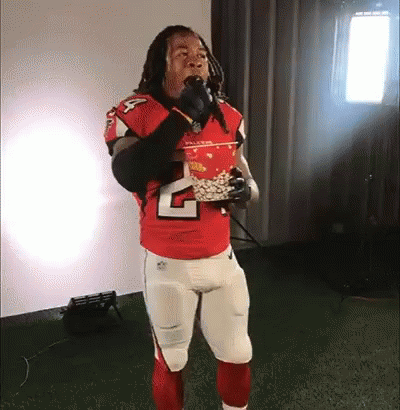 Football Player In Red Jersey Eating Popcorn GIF