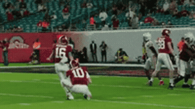 Football Player In Red Jersey Number 10 Kicking Ball GIF