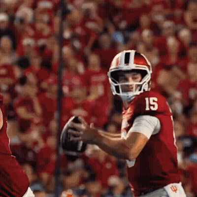 Football Player In Red Jersey Number 15 Holding Football GIF