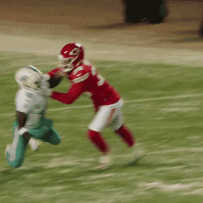 Football Player In Red Jersey Number 23 Tackling GIF
