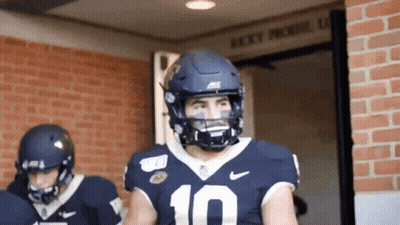 Football Player In Red Jersey Number 4 Surrounded GIF