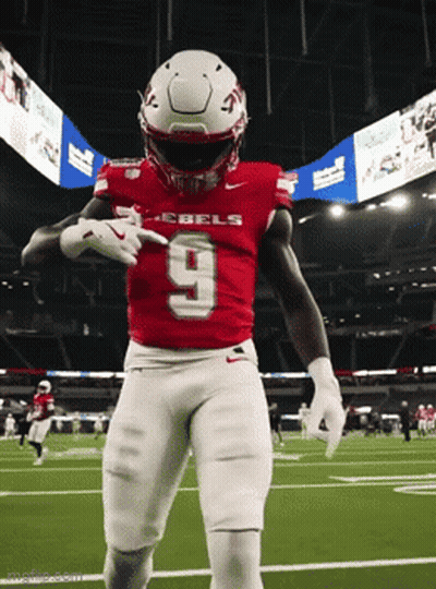 Football Player In Red Rebels Jersey Dancing GIF