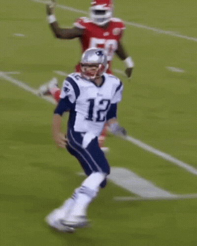 Football Player In Red Tackled By Player In White GIF