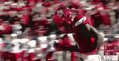 Football Player In Red Uniform Running With Scoreboard GIF