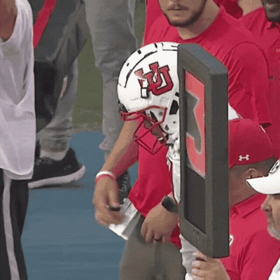 Football Player In Red Utah Jersey Holding Ball GIF