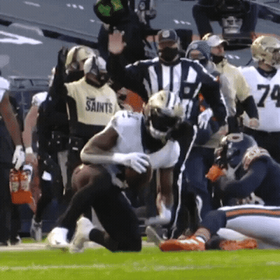 Football Player In Saints Jersey Being Tackled GIF