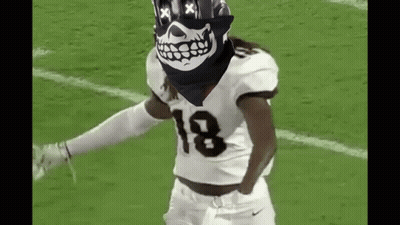 Football Player In Skull Bandana Dancing On Field GIF
