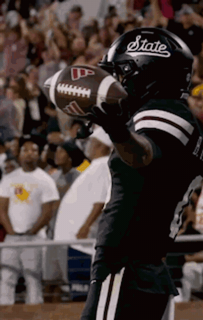 Football Player In State Helmet Holding Football GIF