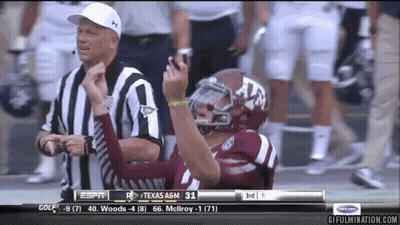 Football Player In Texas A&M Helmet Next To Referee GIF
